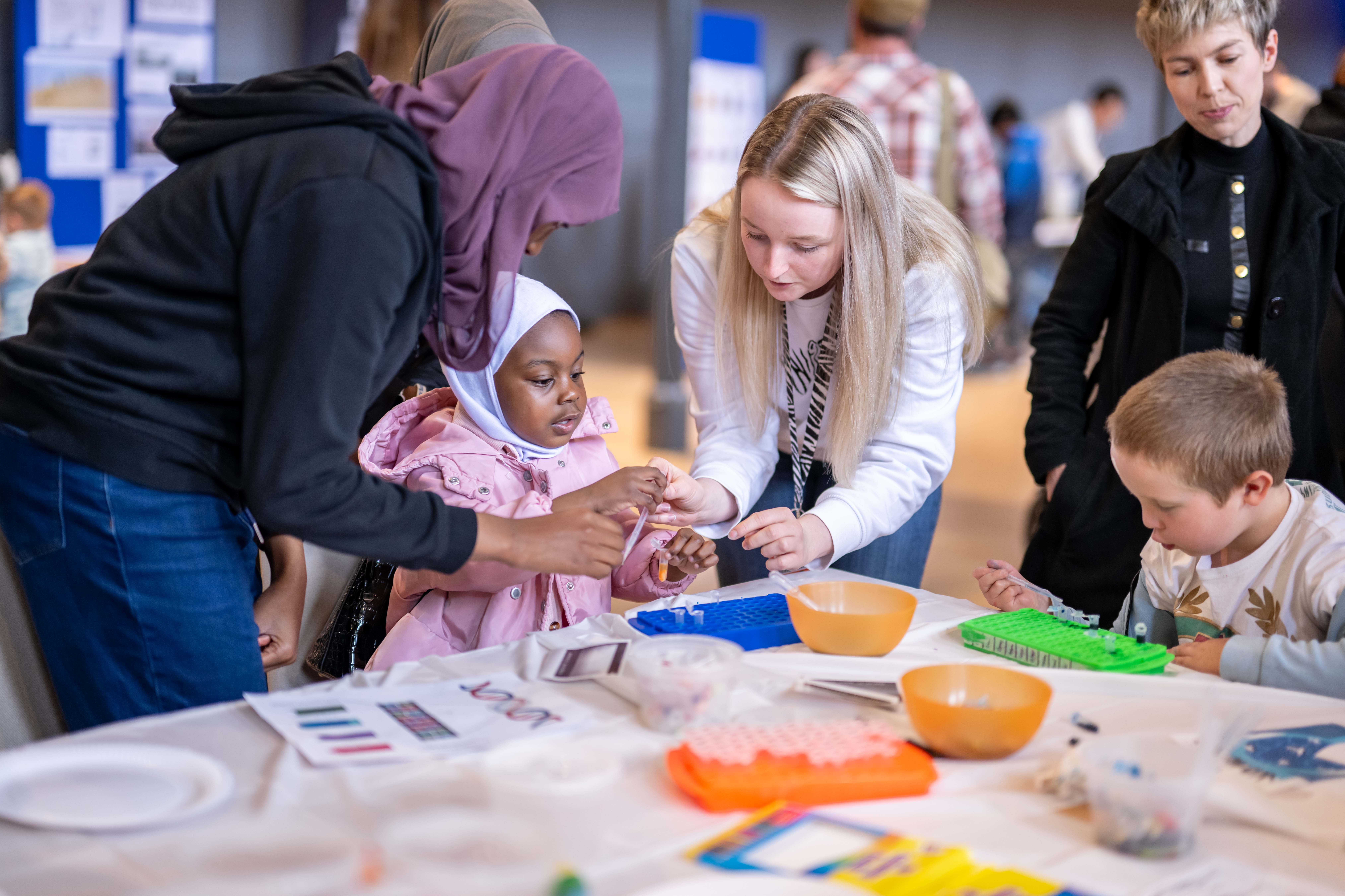 Inspiring Young Minds at Explorathon 2023 – researchers at event with families