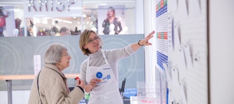 Nurse giving advice to elderly woman