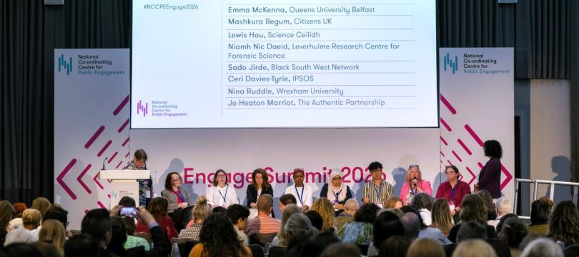 Panellists and delegates in discussion at the Engage Summit with a slide showing "Imagine Out Future: Setting the North Star." 