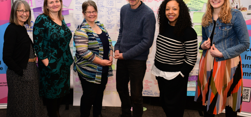 Ann, Zoe, Sophie, Paul, Gemma and Asphodel standing together and smiling at the NCIA action learning event