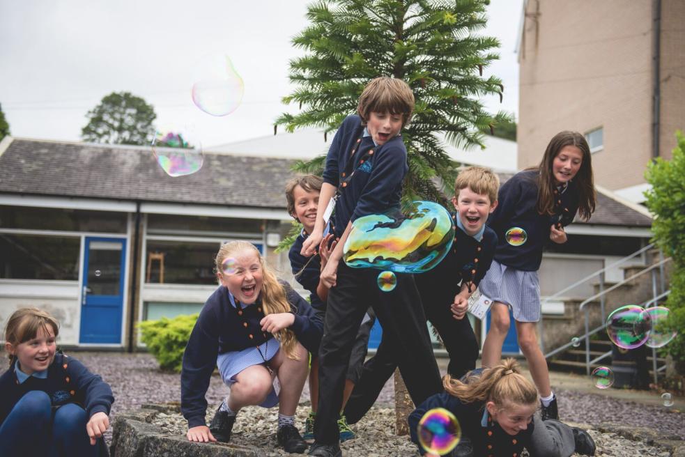 Children playing with bubbles