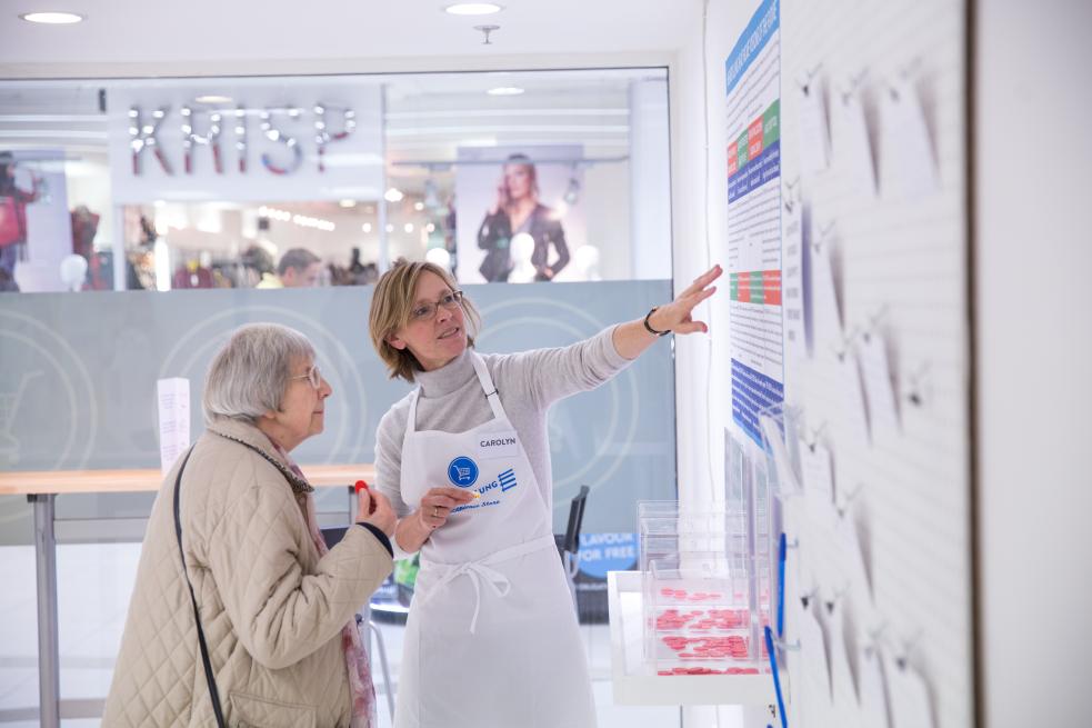 Nurse giving advice to elderly woman