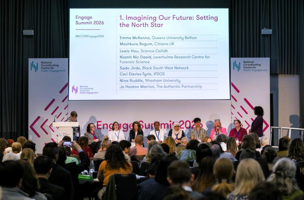 Panellists and delegates in discussion at the Engage Summit with a slide showing "Imagine Our Future: Setting the North Star." 