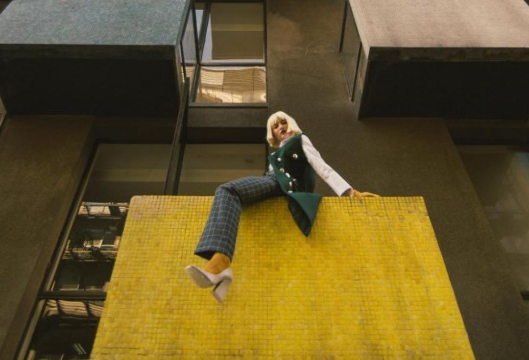 Woman on a building balcony 2