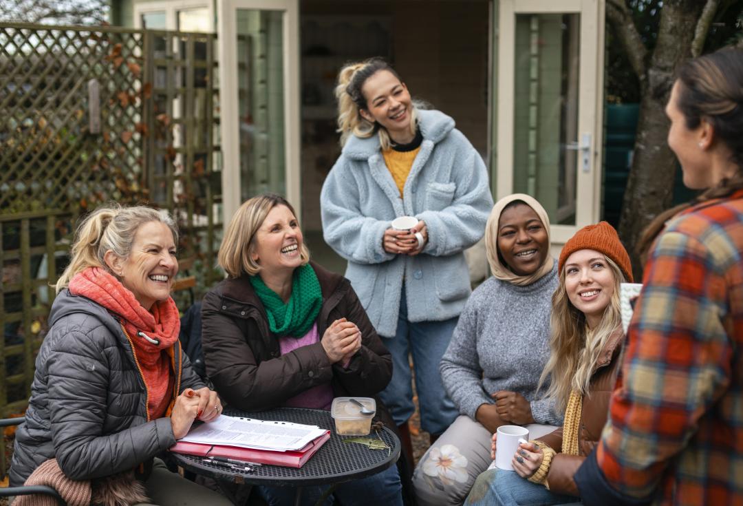 A group of women laughing together 