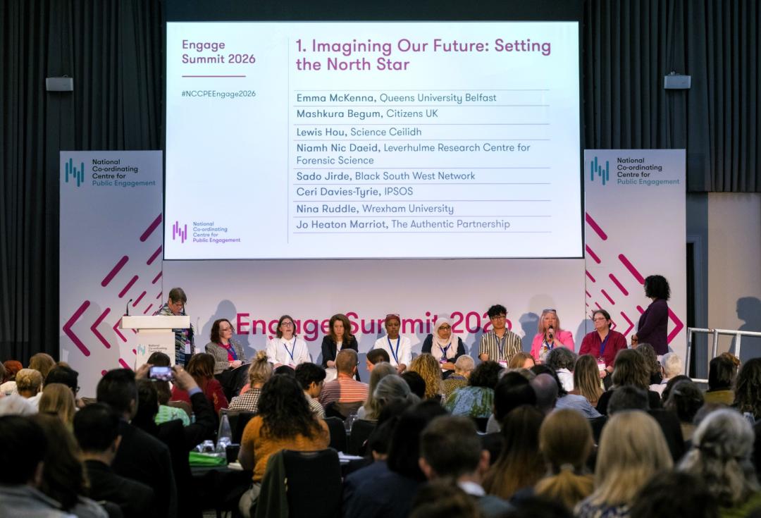 Panellists and delegates in discussion at the Engage Summit with a slide showing "Imagine Out Future: Setting the North Star." 