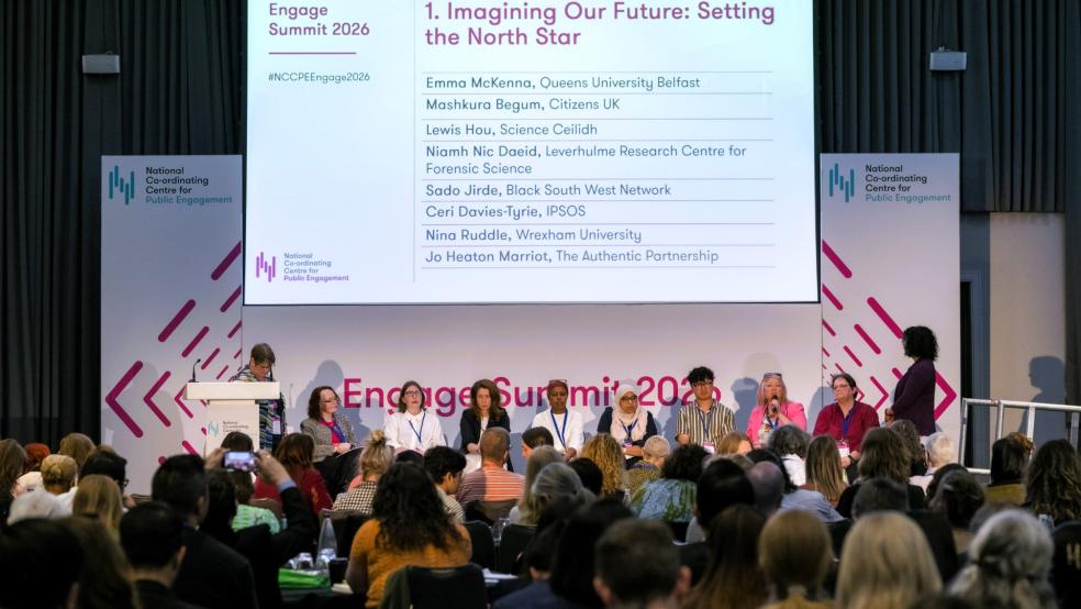 Panellists and delegates in discussion at the Engage Summit with a slide showing "Imagine Out Future: Setting the North Star." 