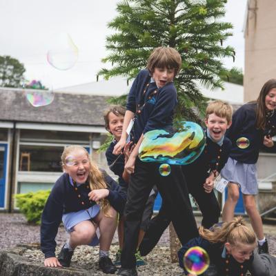 Children playing with bubbles