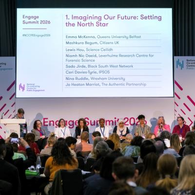 Panellists and delegates in discussion at the Engage Summit with a slide showing "Imagine Out Future: Setting the North Star." 
