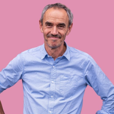 Photo of Paul Manners in a blue shirt smiling at the camera