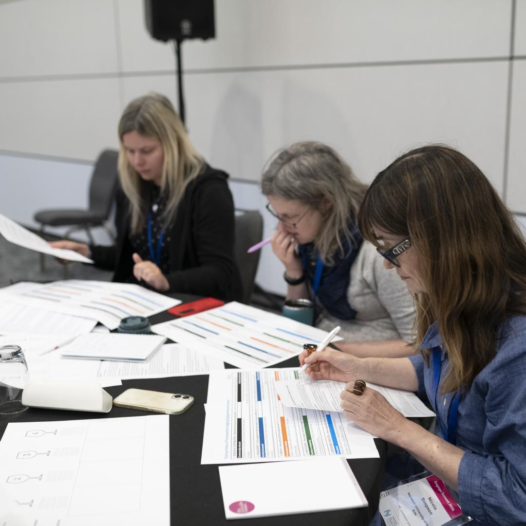 Three people working through activities on the REF101